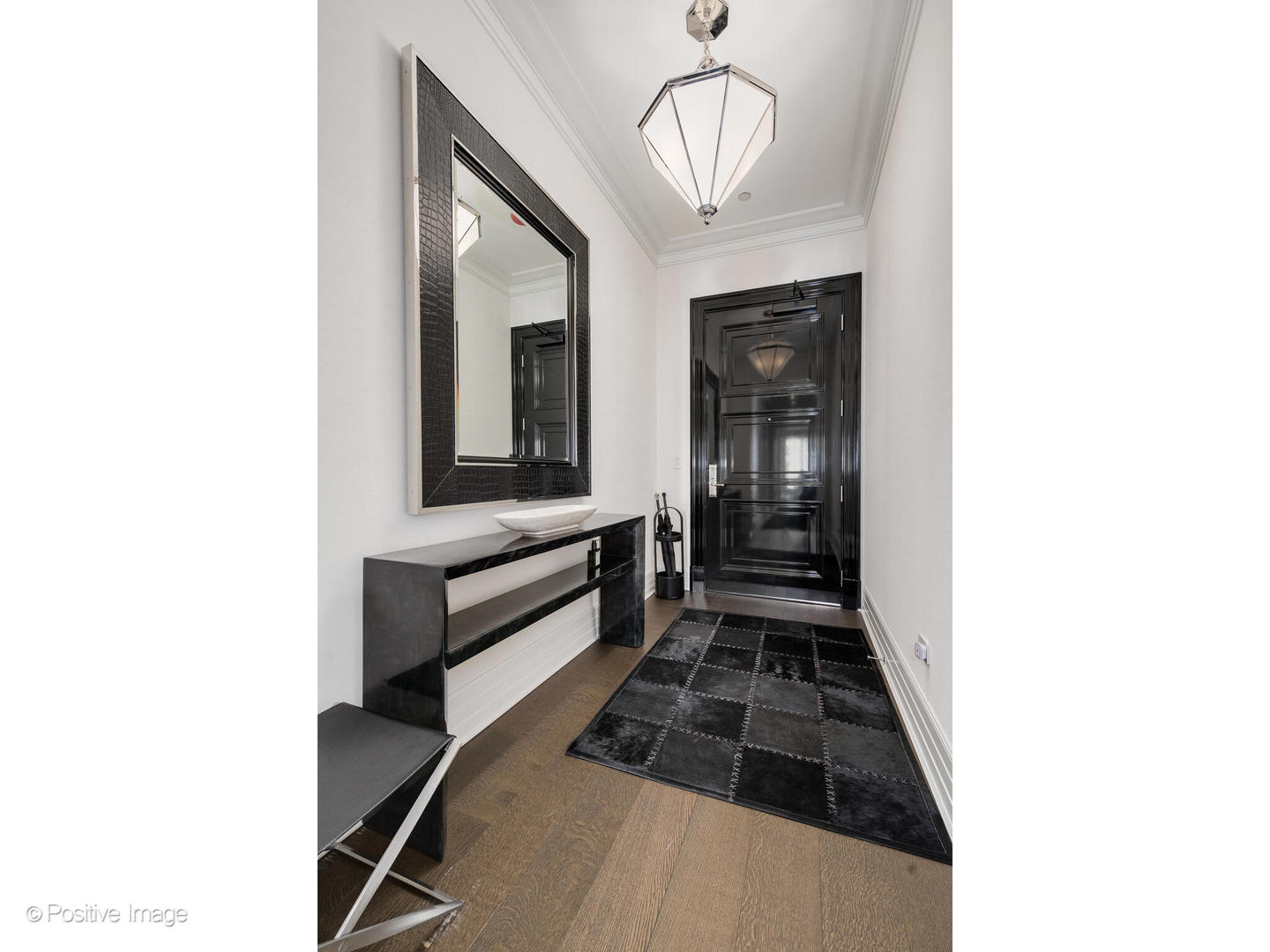 9 West Walton Street, Unit 1501 Chicago, IL 60610 - Photo 4 of 37 a bathroom with a sink and a mirror