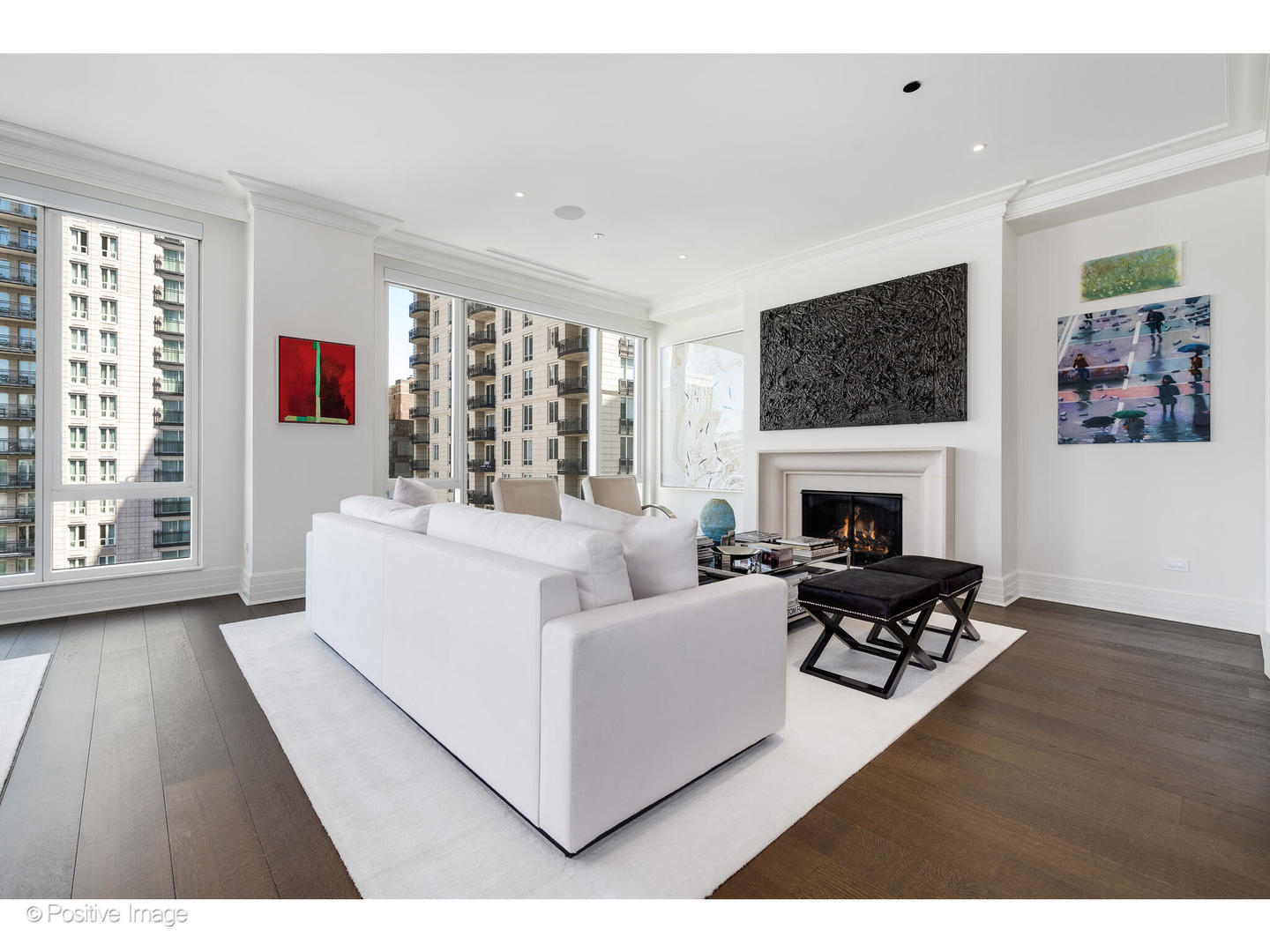 9 West Walton Street, Unit 1501 Chicago, IL 60610 - Photo 6 of 37 a living room with furniture a fireplace and a large window