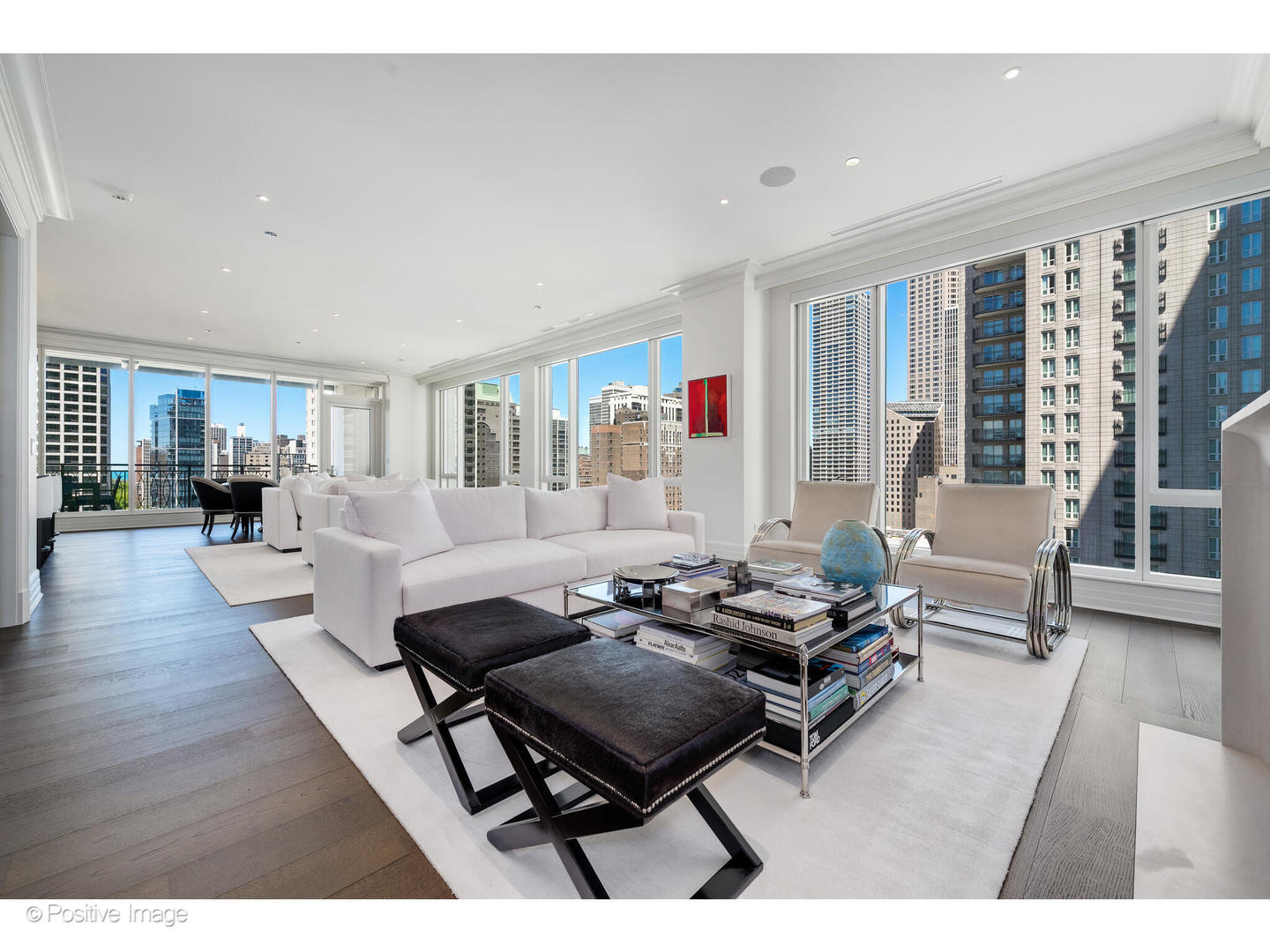 9 West Walton Street, Unit 1501 Chicago, IL 60610 - Photo 7 of 37 a living room with furniture and a wooden floor