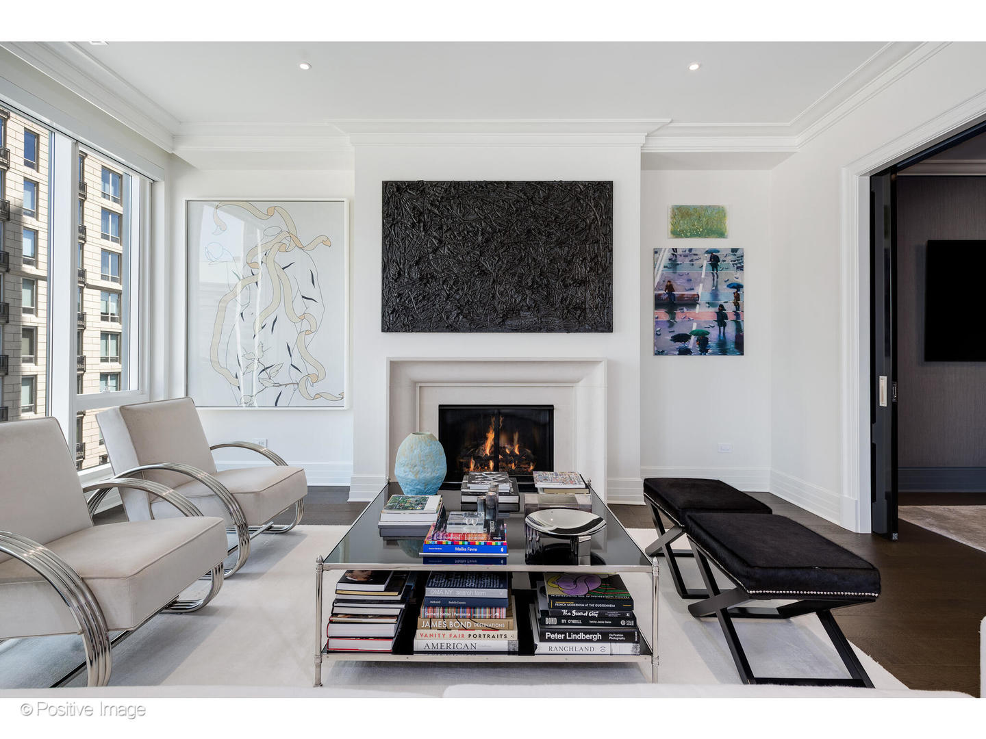 9 West Walton Street, Unit 1501 Chicago, IL 60610 - Photo 10 of 37 a living room with furniture a flat screen tv and a fireplace