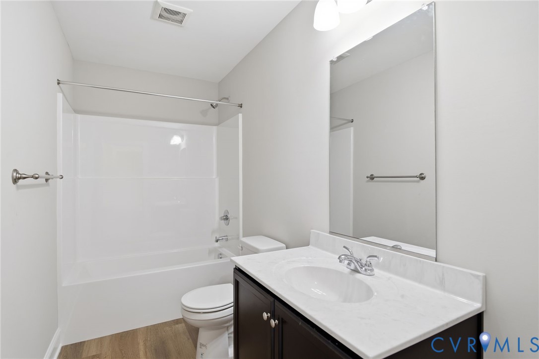 17557 Hewlett Road Beaverdam, VA 23015 - Photo 16 of 29 a bathroom with a sink a toilet and shower