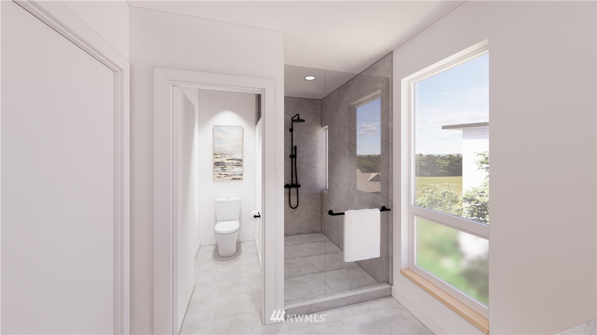 5204 Renton Avenue South Seattle, WA 98118 - Photo 5 of 9 a bathroom with a glass shower door