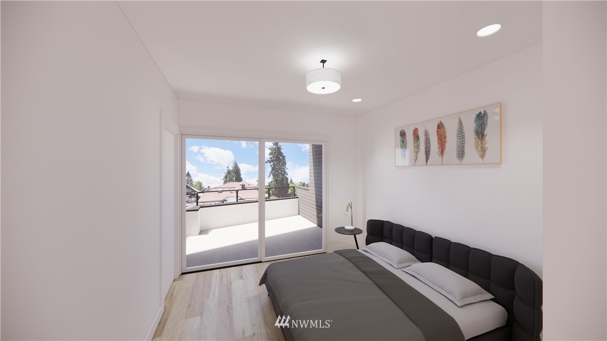 5204 Renton Avenue South Seattle, WA 98118 - Photo 6 of 9 a bedroom with a bed and a large window