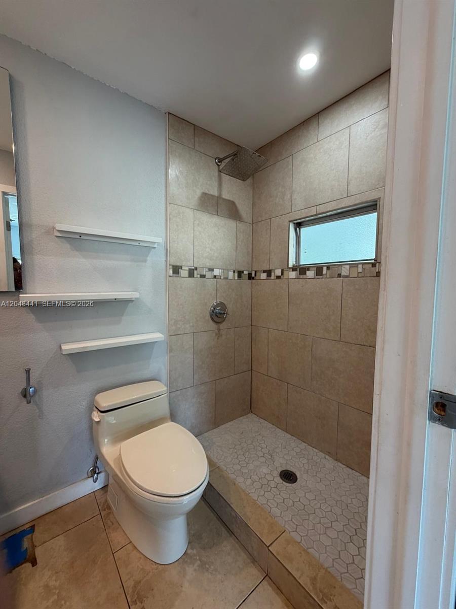 5331 Southwest 35th Street Davie, FL 33314 - Photo 14 of 31 a bathroom with a shower a toilet and a sink