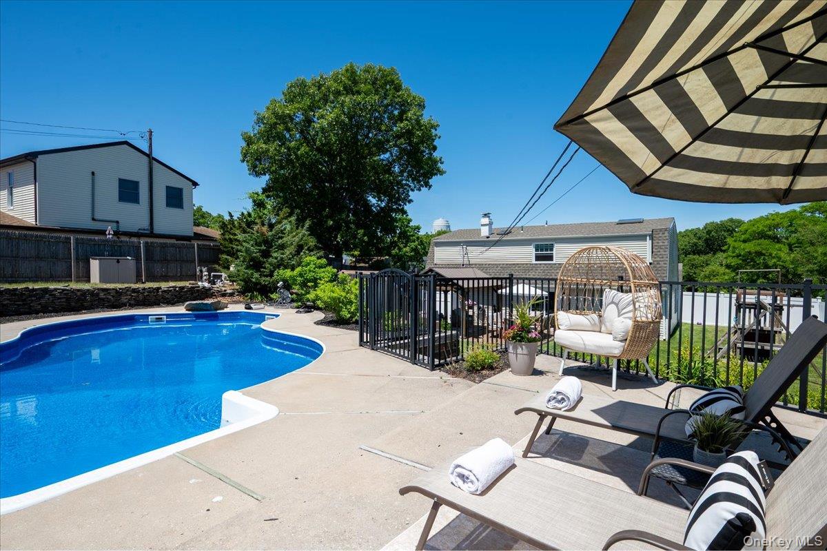 10 Rutgers Road Farmingville, NY 11738 - Photo 26 of 27 a view of a swimming pool with a patio