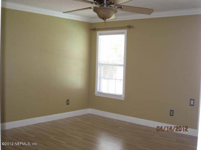 12333 Raleigh Ridge Drive Jacksonville, FL 32225 - Photo 3 of 5 an empty room with a window