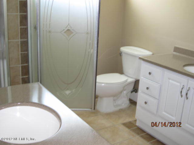 12333 Raleigh Ridge Drive Jacksonville, FL 32225 - Photo 4 of 5 a bathroom with a sink and toilet