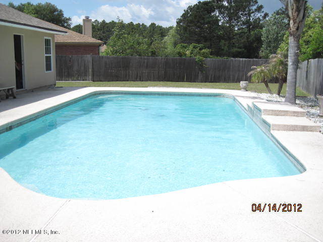 12333 Raleigh Ridge Drive Jacksonville, FL 32225 - Photo 5 of 5 a view of a backyard