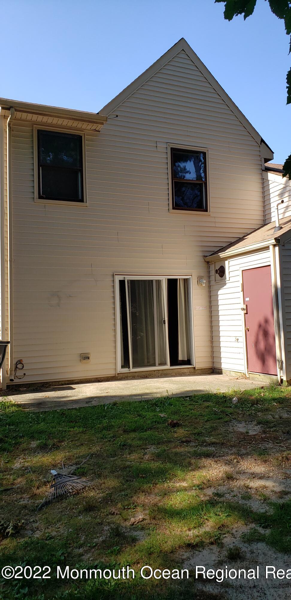 31 Pin Oak Lane Little Egg Harbor, NJ 08087 - Photo 10 of 10 Back view with patio,door to HVAC room