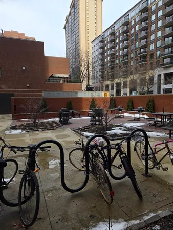 a view of a patio with table and chairs