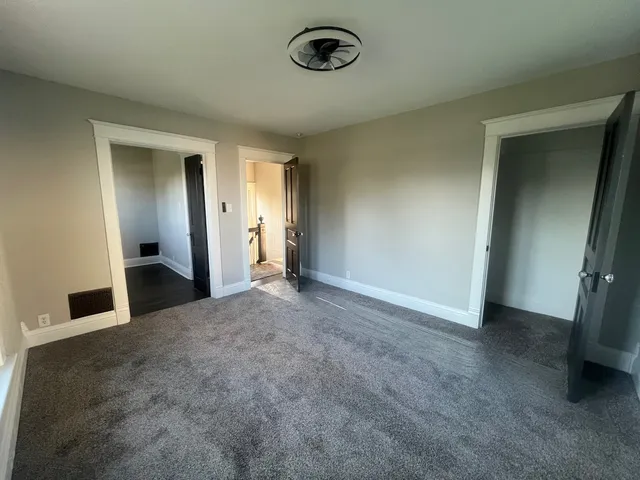 an empty room with a bathroom