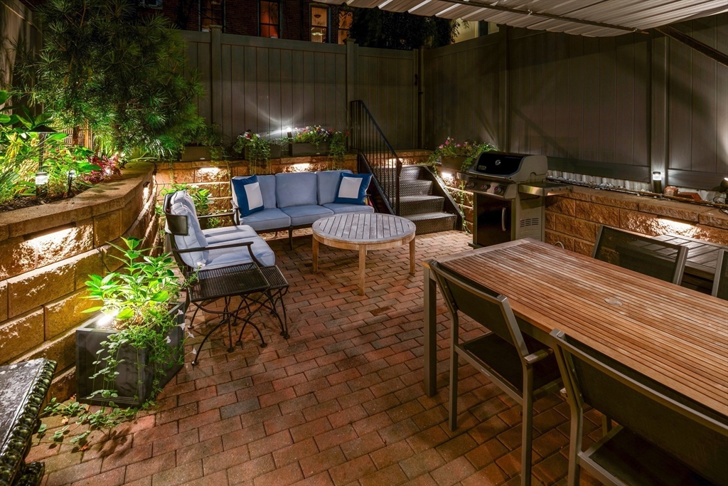109 Appleton Street Boston, MA 02116 - Photo 18 of 30 a view of a patio with table and chairs and potted plants