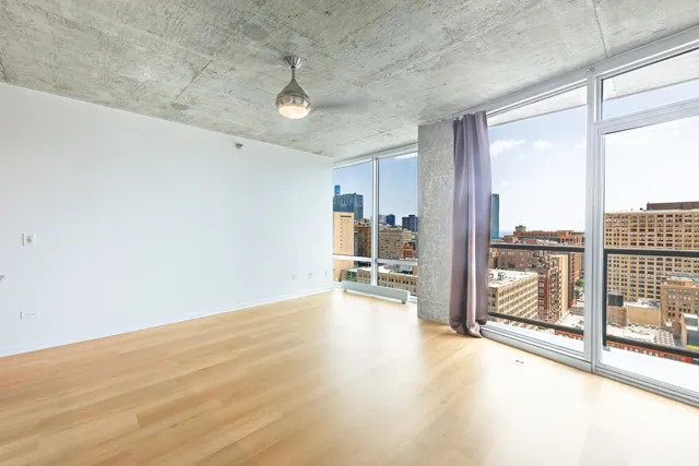 a view of an empty room and a balcony