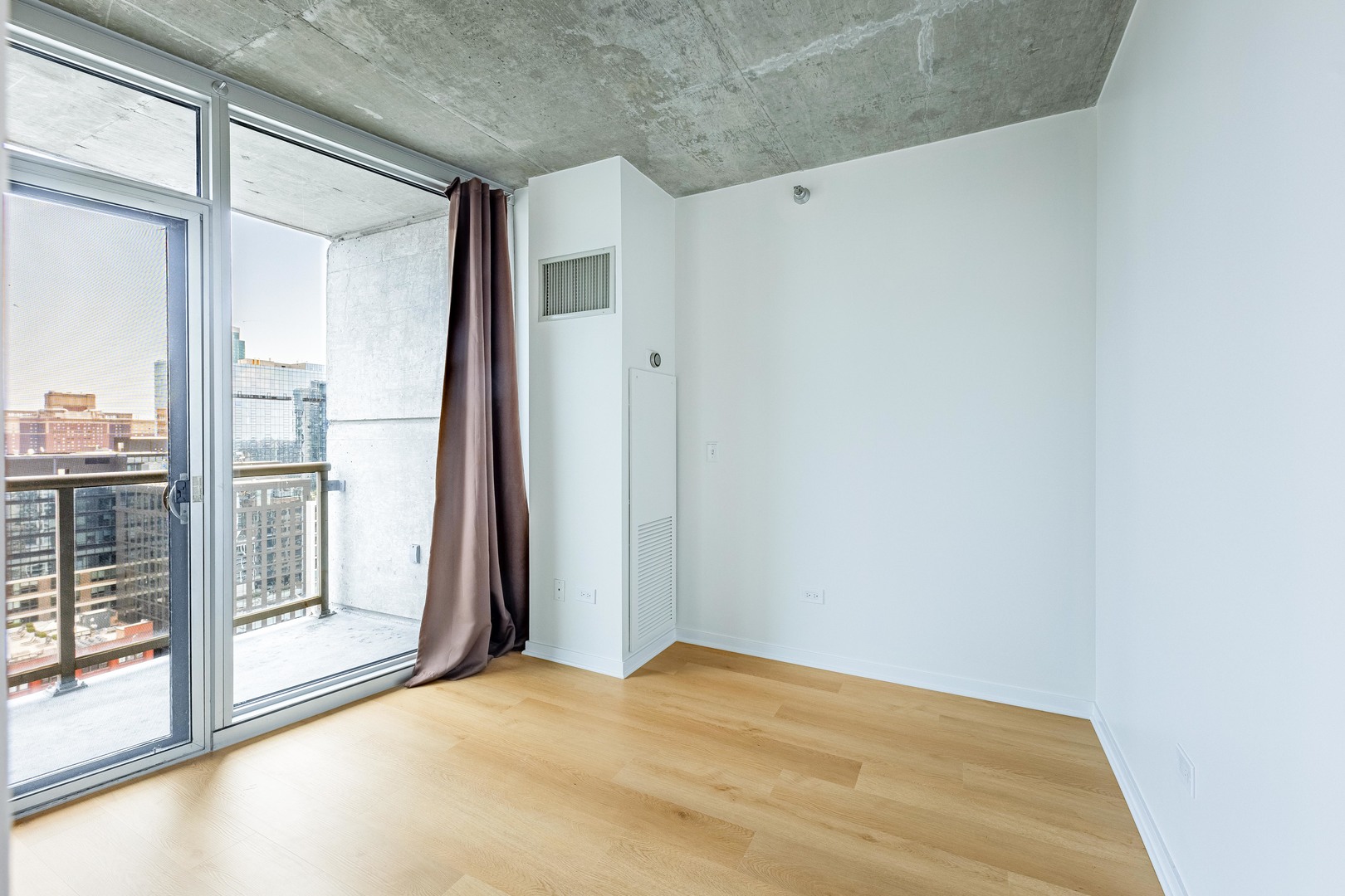 611 South Wells Street, Unit 2301 Chicago, IL 60607 - Photo 15 of 25 a view of empty room with floor to ceiling window