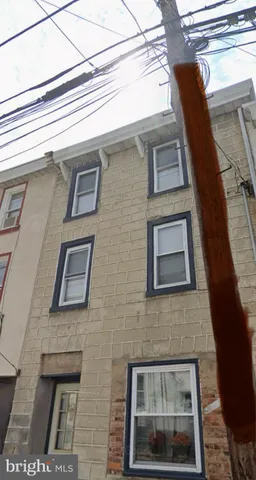 a front view of a building with windows