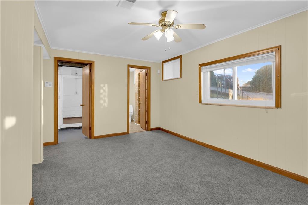 2071-2073 Brodhead Road Aliquippa, PA 15001 - Photo 25 of 34 an empty room with windows and fan