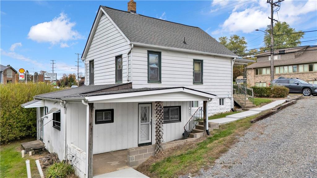 2071-2073 Brodhead Road Aliquippa, PA 15001 - Photo 4 of 34 a view of a white house with a sink and yard