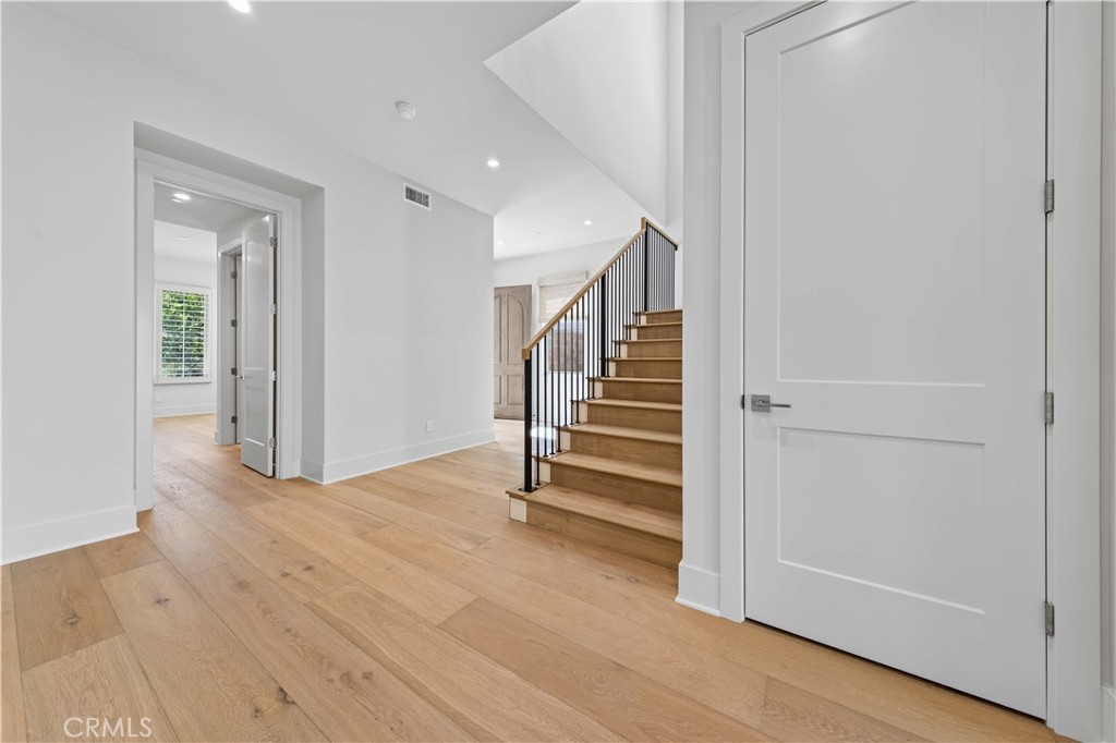 233 Pinnacle Irvine, CA 92602 - Photo 11 of 64 a view of entryway with stairs and wooden floor