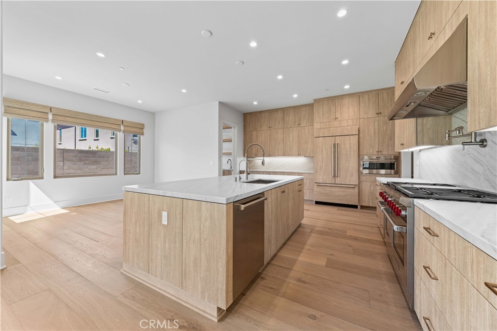 233 Pinnacle Irvine, CA 92602 - Photo 20 of 64 a kitchen with a stove sink and a refrigerator