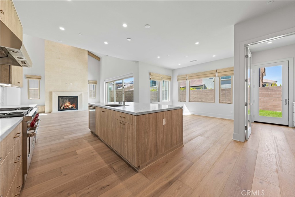 233 Pinnacle Irvine, CA 92602 - Photo 30 of 64 a large kitchen with stainless steel appliances granite countertop a large counter top a stove and a wooden floors