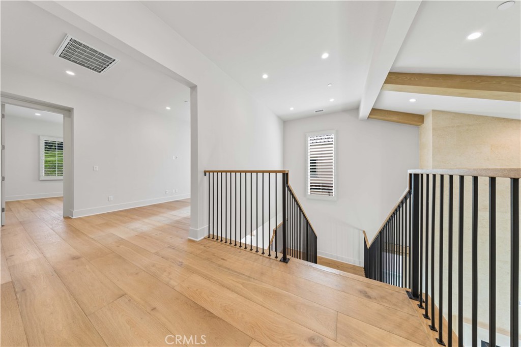 233 Pinnacle Irvine, CA 92602 - Photo 33 of 64 a view of a hallway with wooden floor and staircase