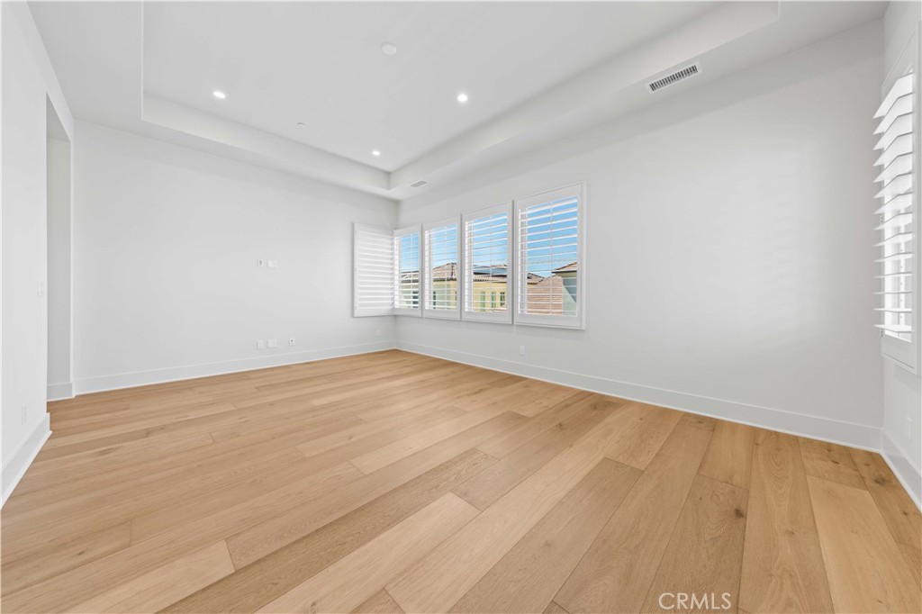 233 Pinnacle Irvine, CA 92602 - Photo 35 of 64 a view of empty room with wooden floor and fan