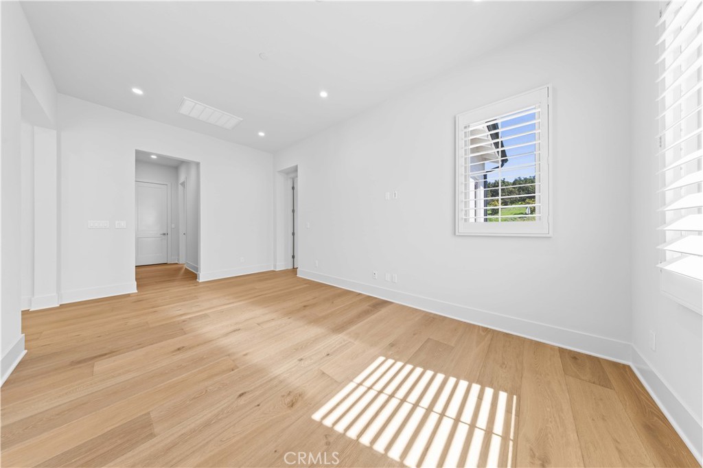 233 Pinnacle Irvine, CA 92602 - Photo 41 of 64 an empty room with wooden floor and windows