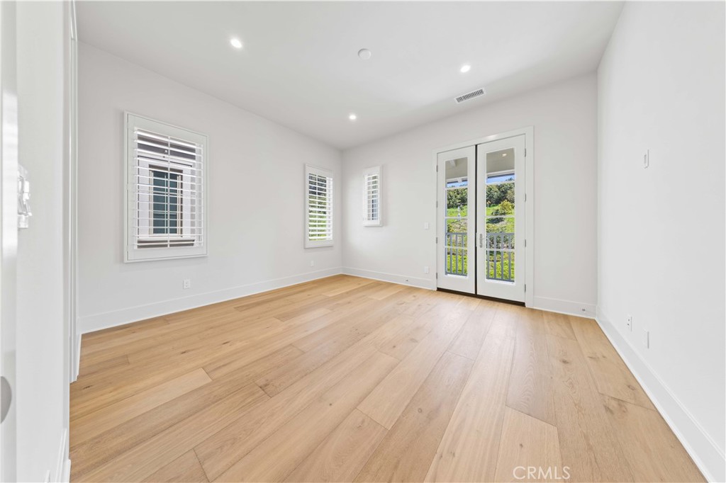 233 Pinnacle Irvine, CA 92602 - Photo 43 of 64 an empty room with wooden floor and windows