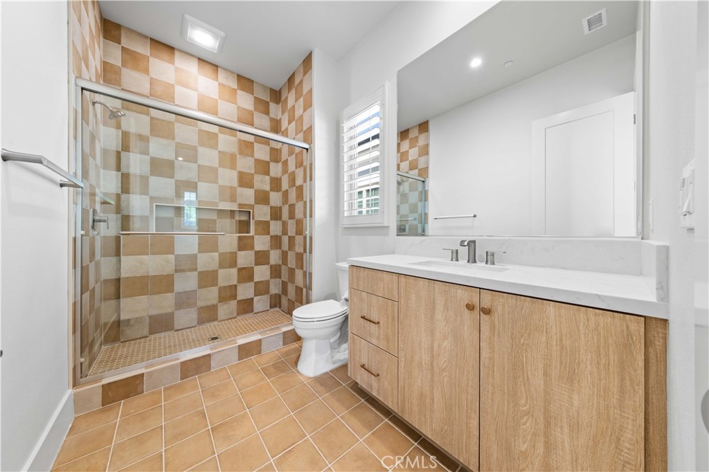 233 Pinnacle Irvine, CA 92602 - Photo 45 of 64 a bathroom with a sink a toilet and shower