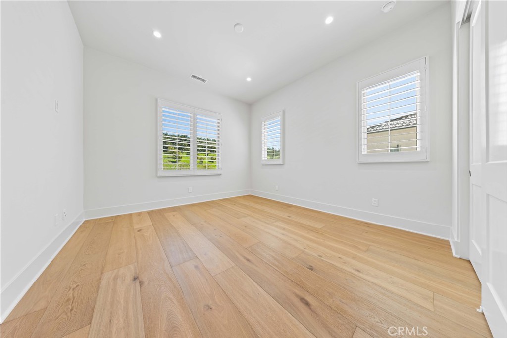 233 Pinnacle Irvine, CA 92602 - Photo 51 of 64 an empty room with wooden floor and windows