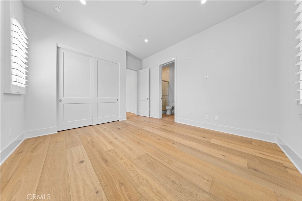 233 Pinnacle Irvine, CA 92602 - Photo 52 of 64 a view of empty room with wooden floor