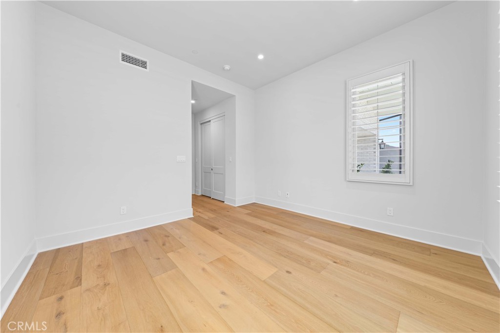 233 Pinnacle Irvine, CA 92602 - Photo 8 of 64 a view of empty room with wooden floor