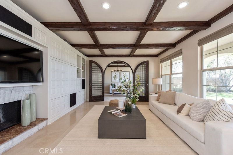 17 Ferrand Newport Coast, CA 92657 - Photo 11 of 34 a living room with fireplace furniture and a flat screen tv