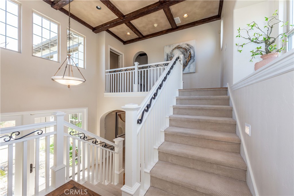 17 Ferrand Newport Coast, CA 92657 - Photo 18 of 34 a view of staircase with lots of frames on wall and a window