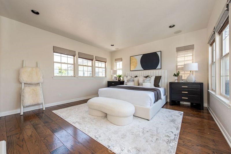 17 Ferrand Newport Coast, CA 92657 - Photo 25 of 34 a bedroom with a bed and wooden floor