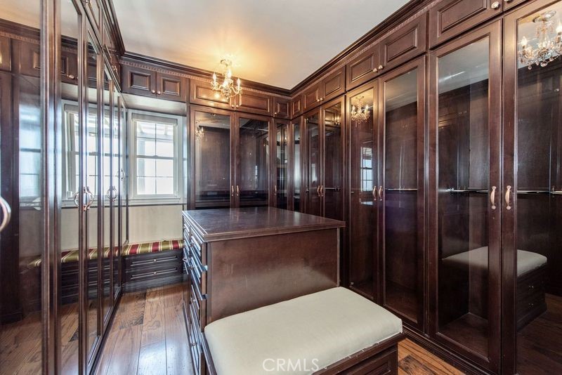 17 Ferrand Newport Coast, CA 92657 - Photo 27 of 34 a bathroom with a toilet a sink and glass door