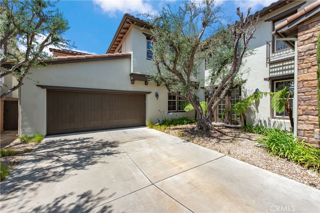 17 Ferrand Newport Coast, CA 92657 - Photo 32 of 34 a front view of a house with a yard and garage
