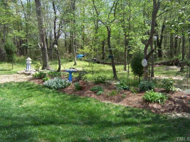 5632 Keowee Way Raleigh, NC 27616 - Photo 8 of 8 Landscaped backyard