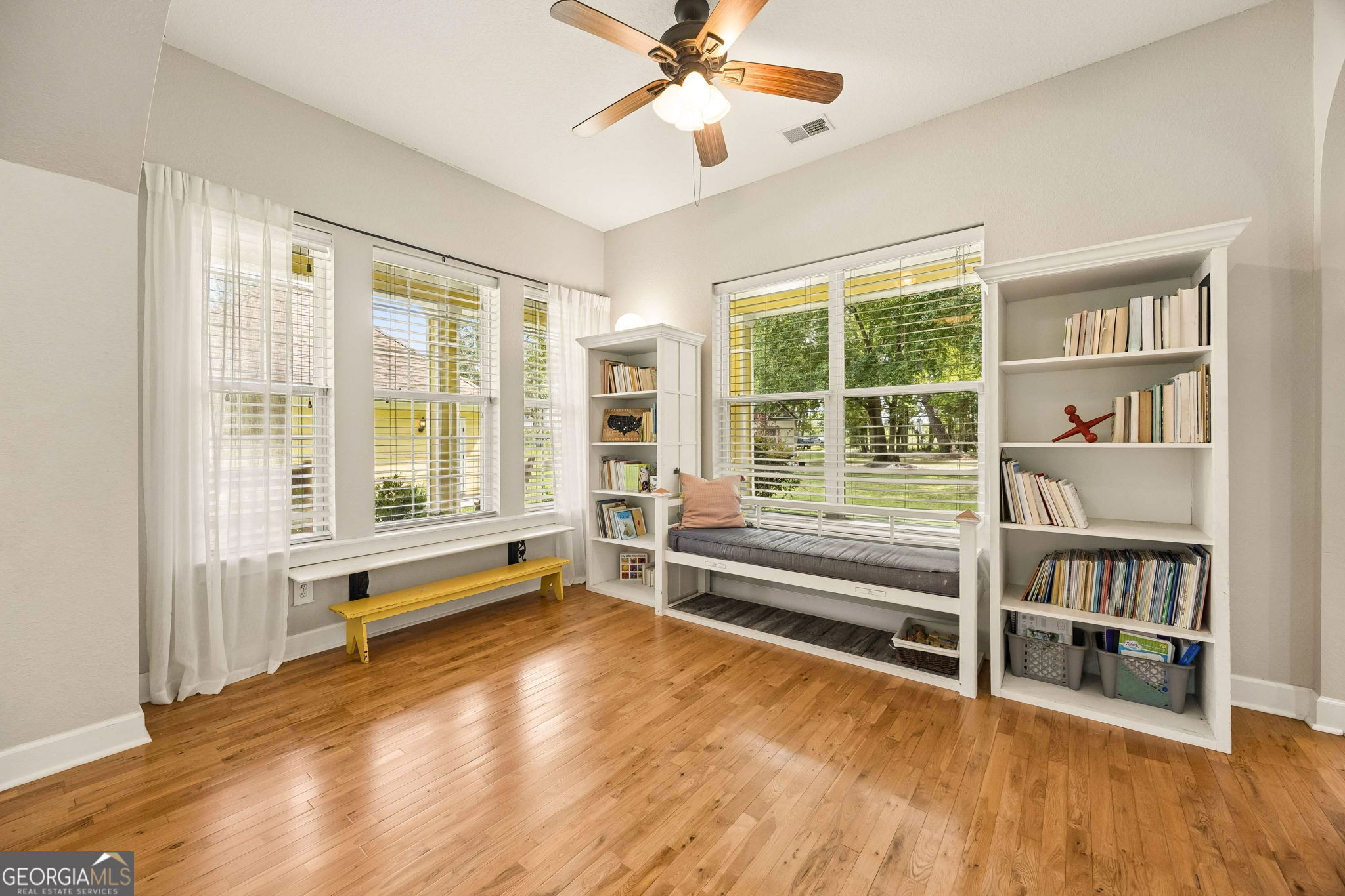706 Hopewell Point Road White Oak, GA 31568 - Photo 10 of 84 Large windows overlook the front porch and grounds, making this bright and inviting room ideal for a home office, library, playroom, or additional living space.