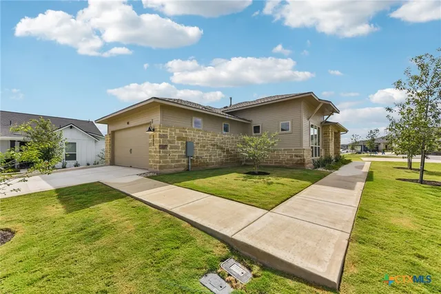 a house with swimming pool in front of it