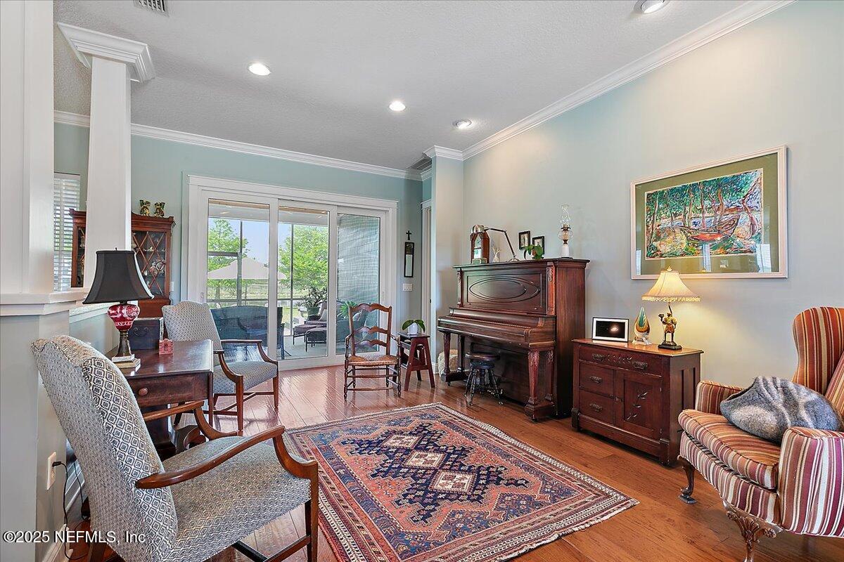 411 Ranch Road Ponte Vedra, FL 32081 - Photo 13 of 56 a living room with furniture and a flat screen tv