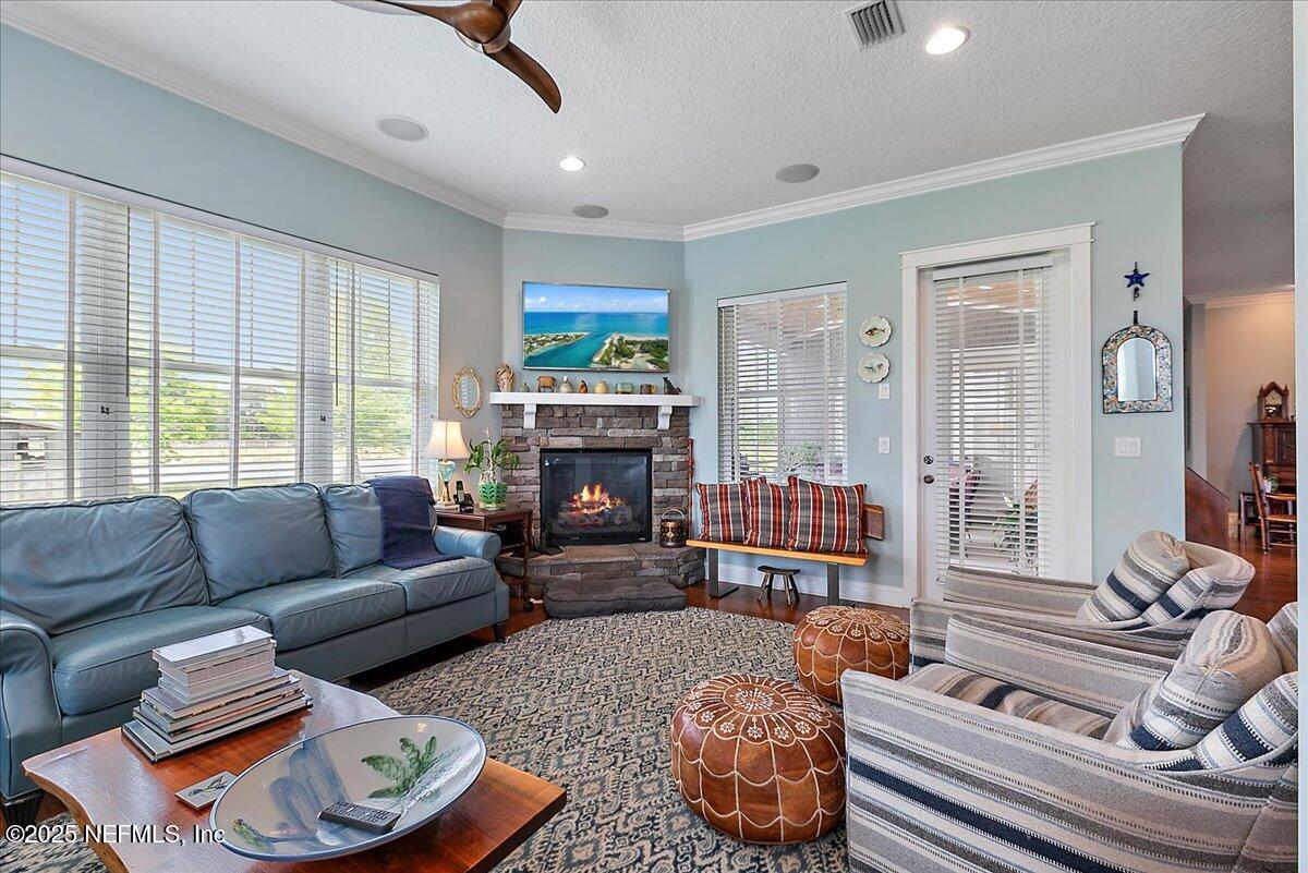 411 Ranch Road Ponte Vedra, FL 32081 - Photo 19 of 56 a living room with furniture a fireplace and a large window
