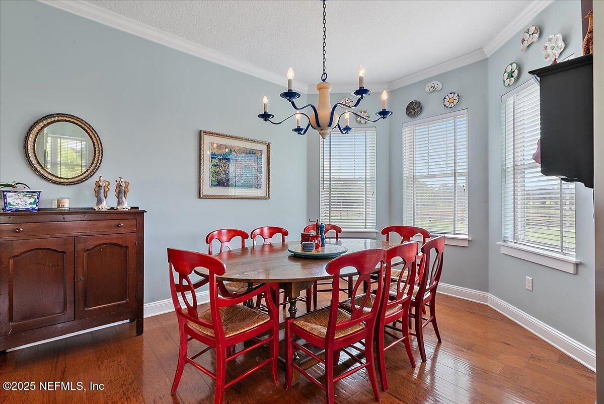 411 Ranch Road Ponte Vedra, FL 32081 - Photo 20 of 56 a view of a dining room with furniture window and wooden floor