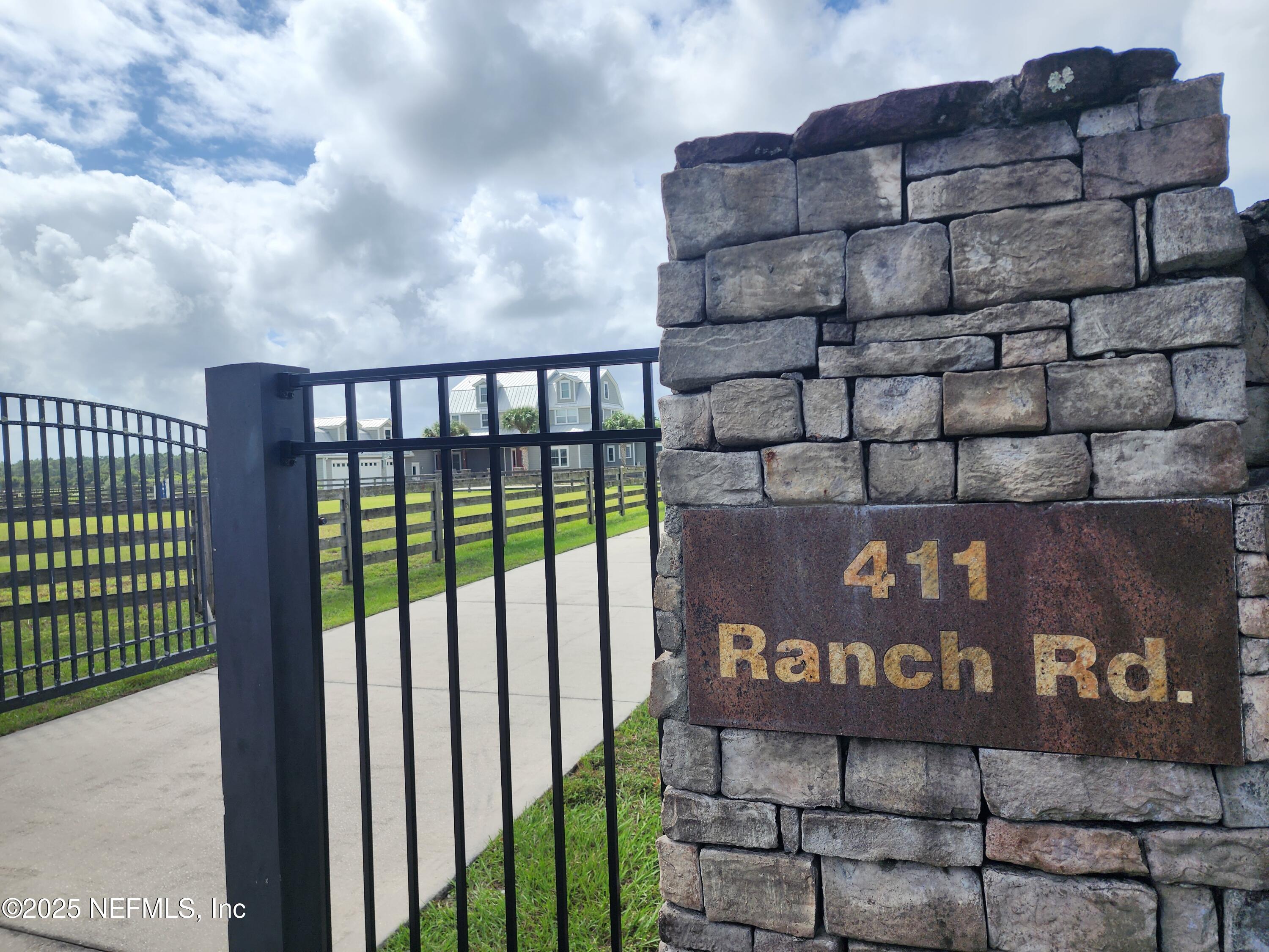 411 Ranch Road Ponte Vedra, FL 32081 - Photo 2 of 56 a sign on the side of a building
