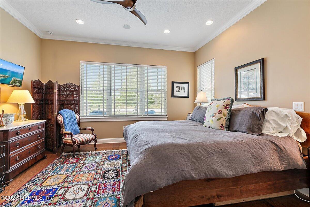 411 Ranch Road Ponte Vedra, FL 32081 - Photo 21 of 56 a bedroom with a bed and wooden floor