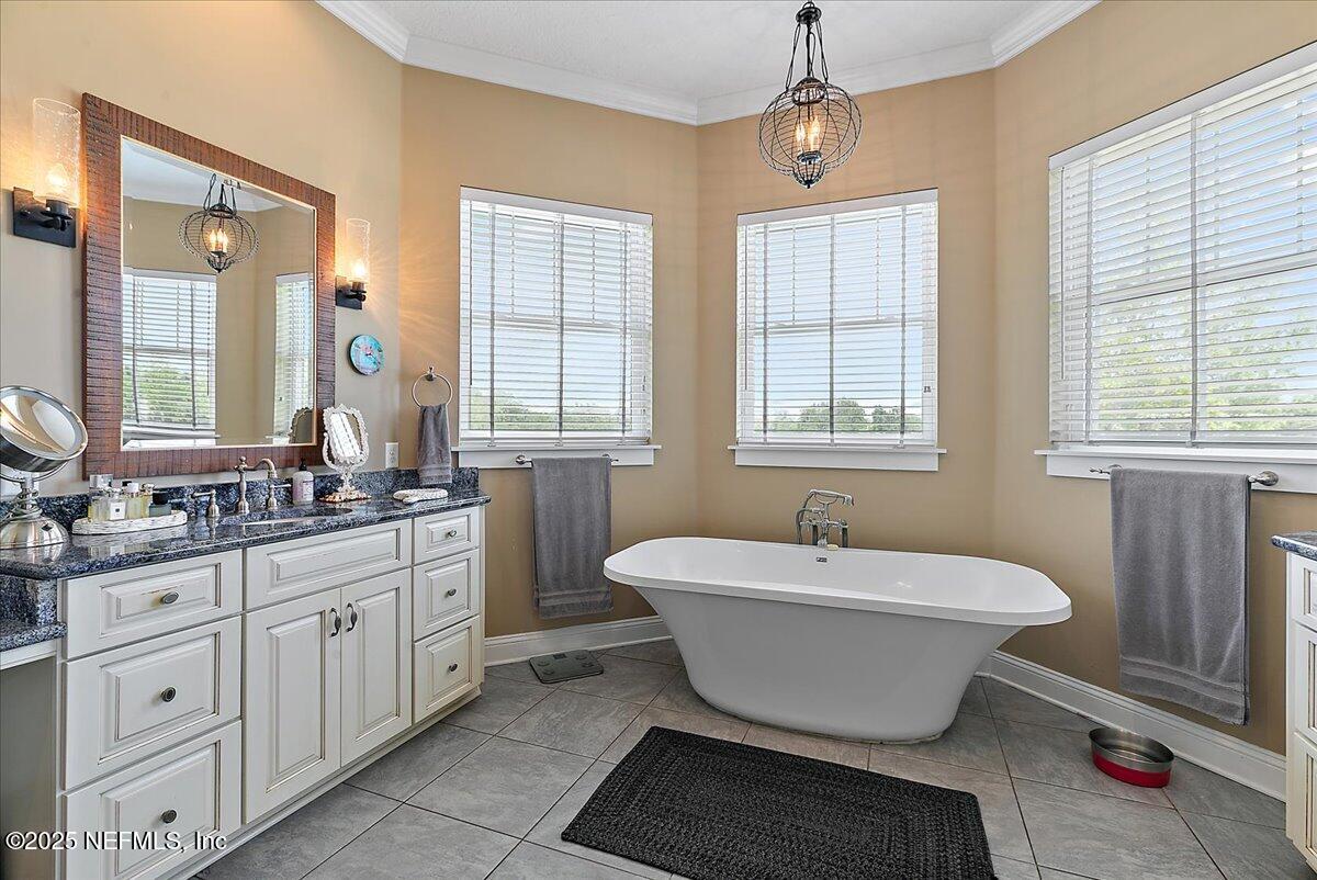 411 Ranch Road Ponte Vedra, FL 32081 - Photo 23 of 56 a spacious bathroom with a bathtub sink and mirror