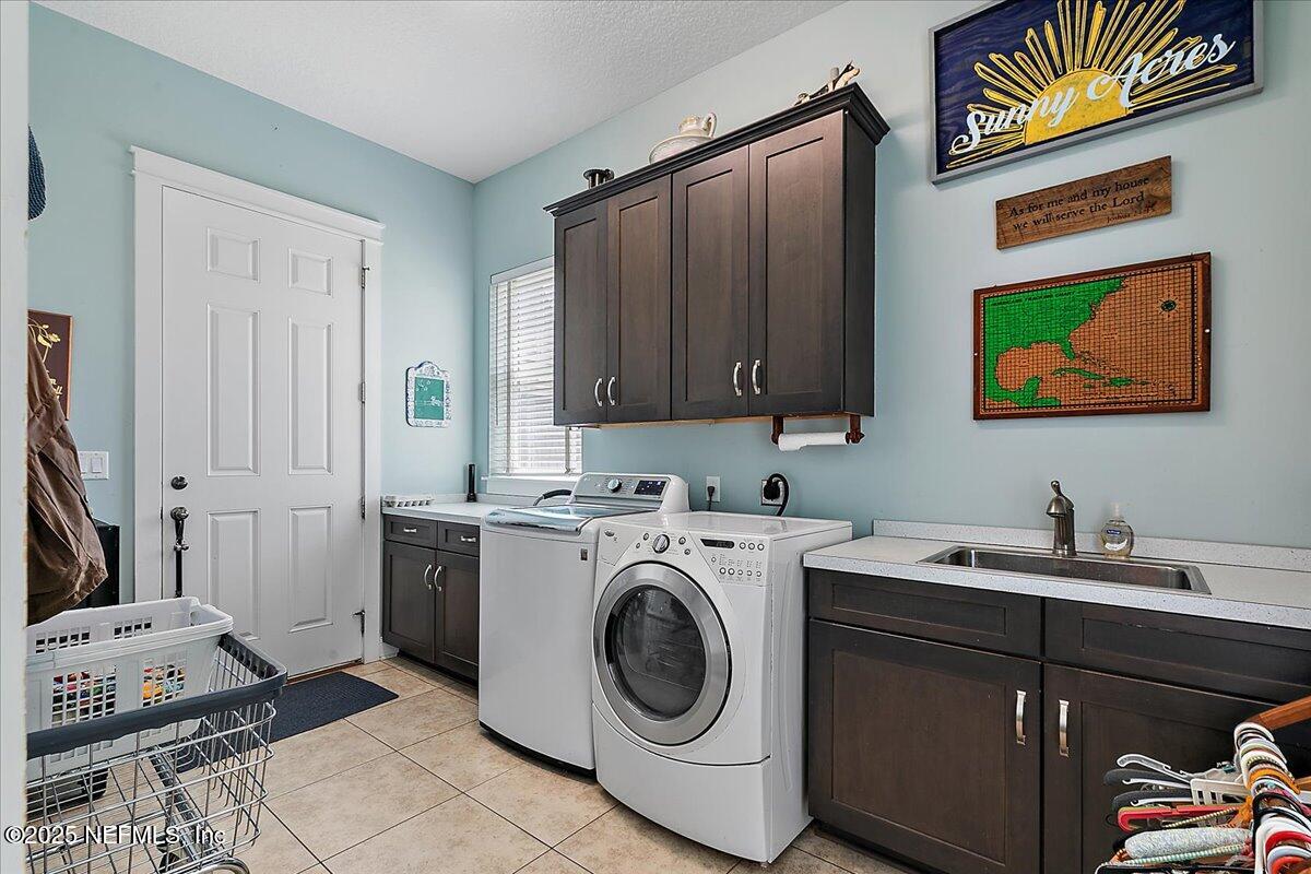 411 Ranch Road Ponte Vedra, FL 32081 - Photo 27 of 56 a utility room with sink dryer and washer