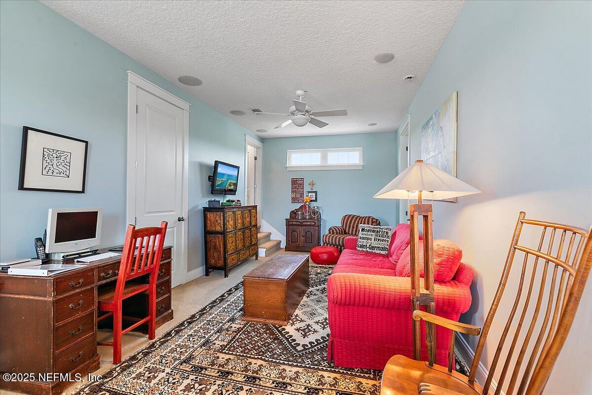 411 Ranch Road Ponte Vedra, FL 32081 - Photo 29 of 56 a living room with furniture and a flat screen tv