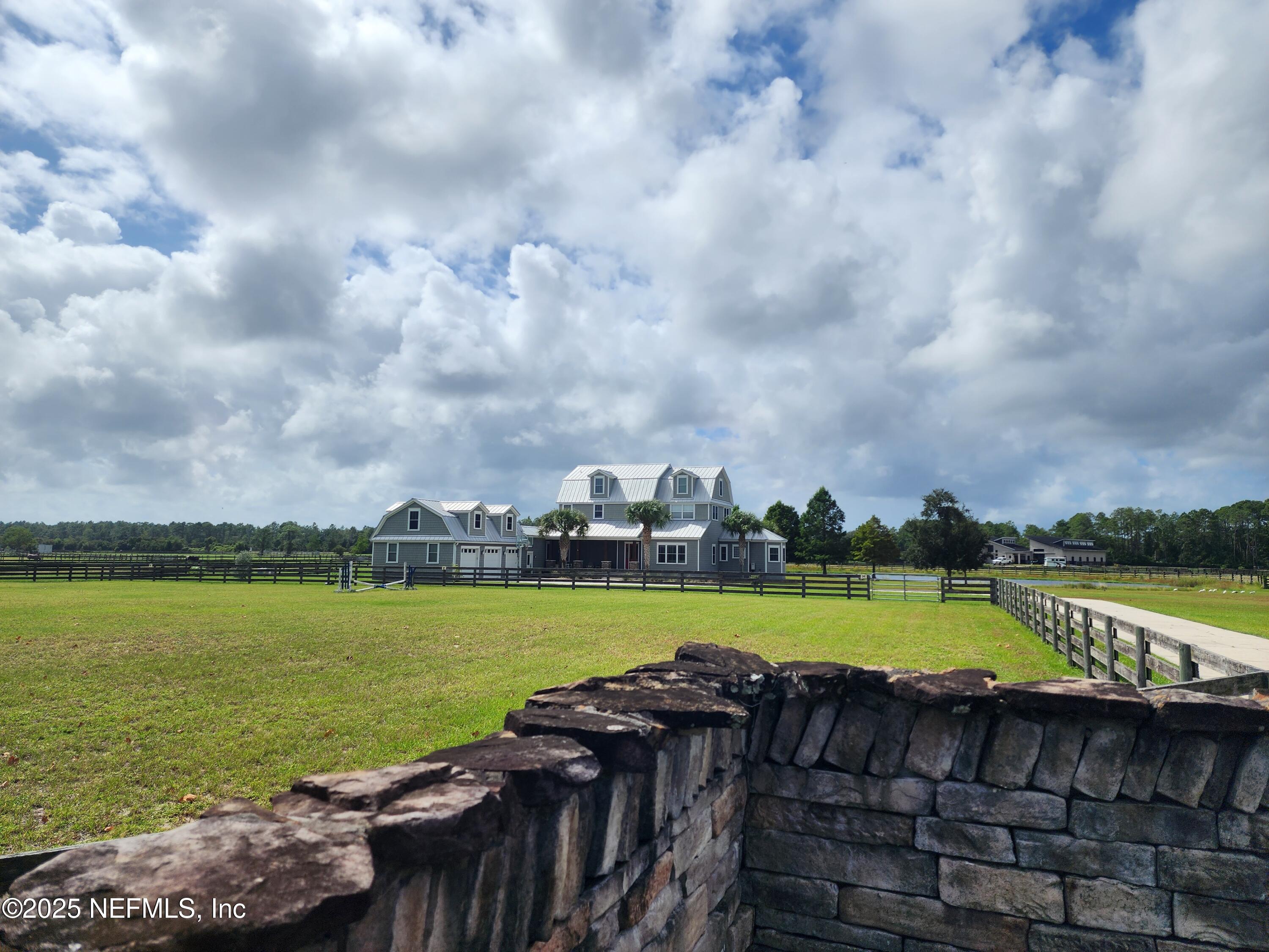 411 Ranch Road Ponte Vedra, FL 32081 - Photo 3 of 56 a view of a lake with houses in the background