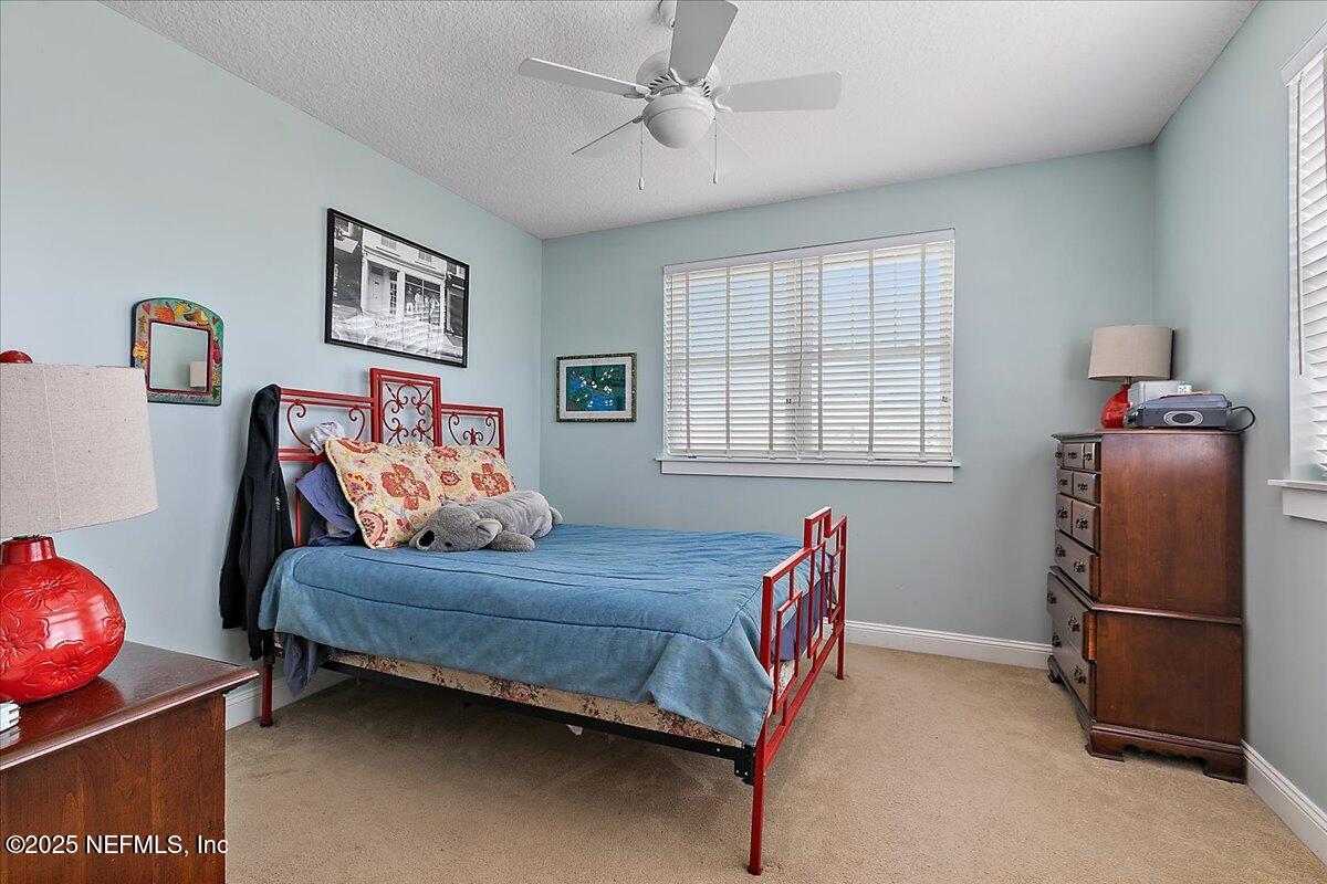 411 Ranch Road Ponte Vedra, FL 32081 - Photo 32 of 56 a bedroom with a bed and a window
